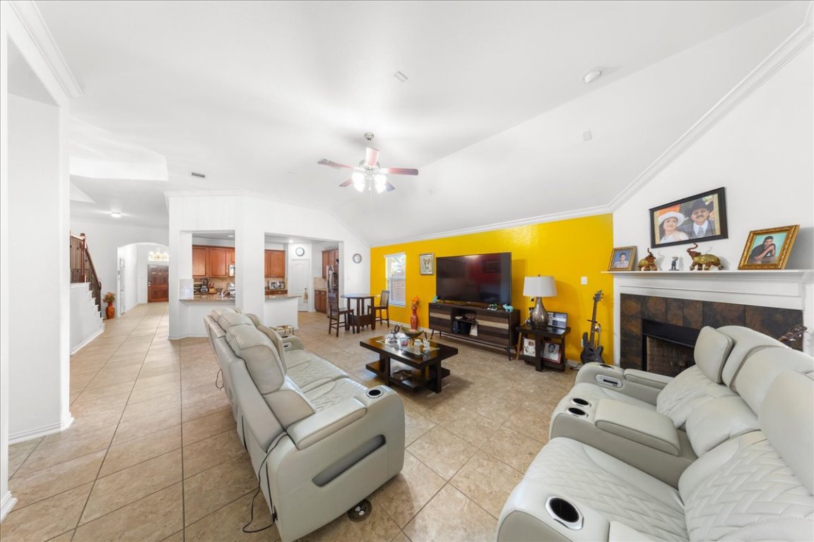 349 Razzmatazz Trail Buda, TX 78610 - Photo 23 of 40 a living room with furniture and a fireplace