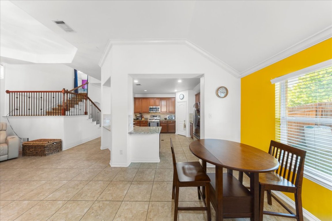 349 Razzmatazz Trail Buda, TX 78610 - Photo 24 of 40 a view of a dining room with furniture and a window