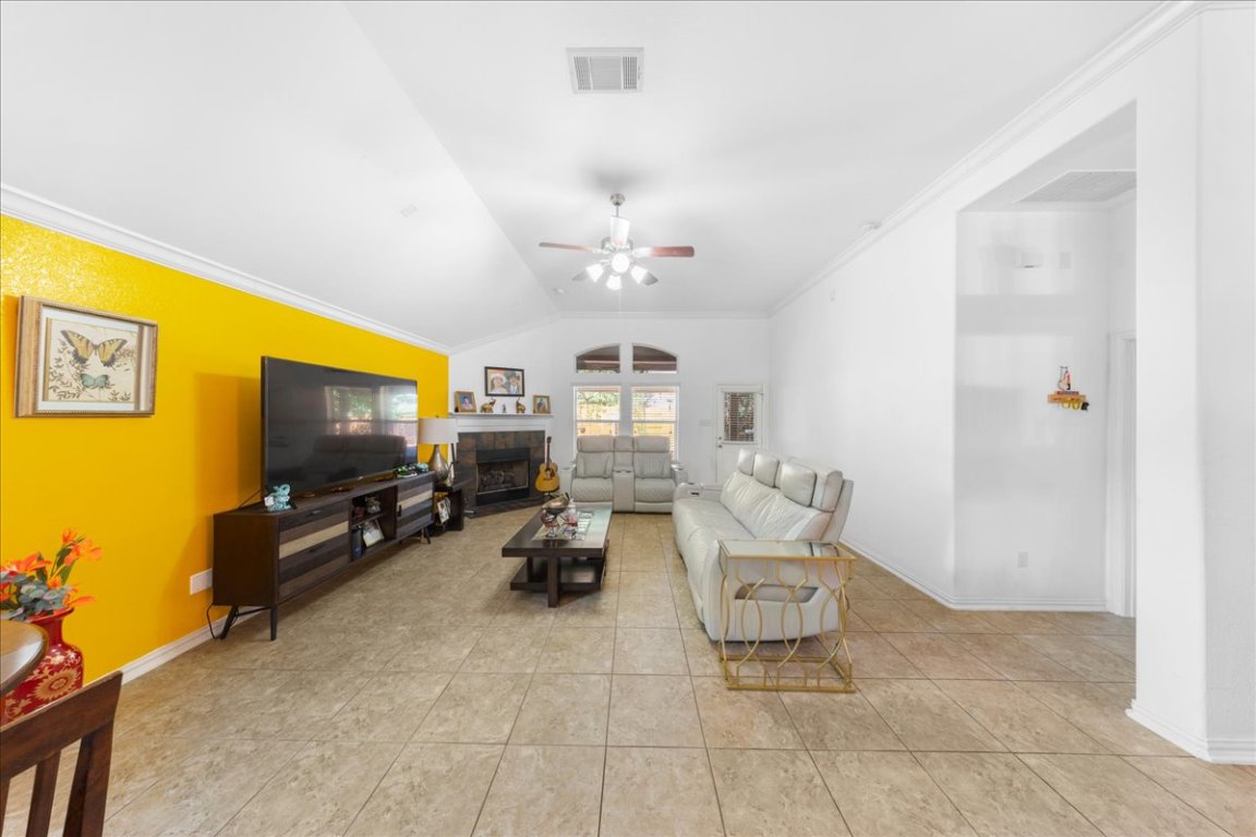 349 Razzmatazz Trail Buda, TX 78610 - Photo 26 of 40 a living room with furniture and a flat screen tv