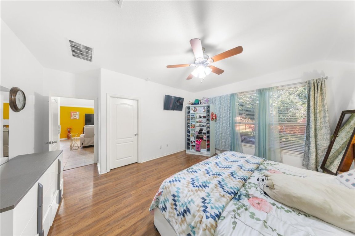 349 Razzmatazz Trail Buda, TX 78610 - Photo 34 of 40 a bedroom with a bed and a large window