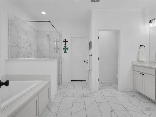 a bathroom with a shower and a sink