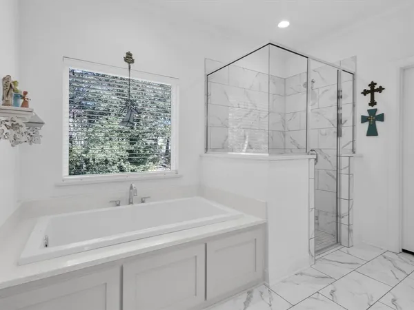 a bathroom with a shower and a sink