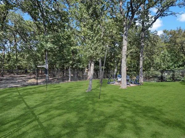 a view of a park with trees and grass