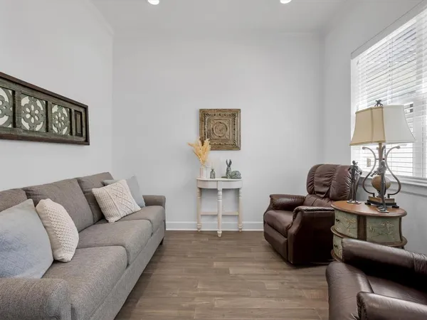 a living room with furniture and a window