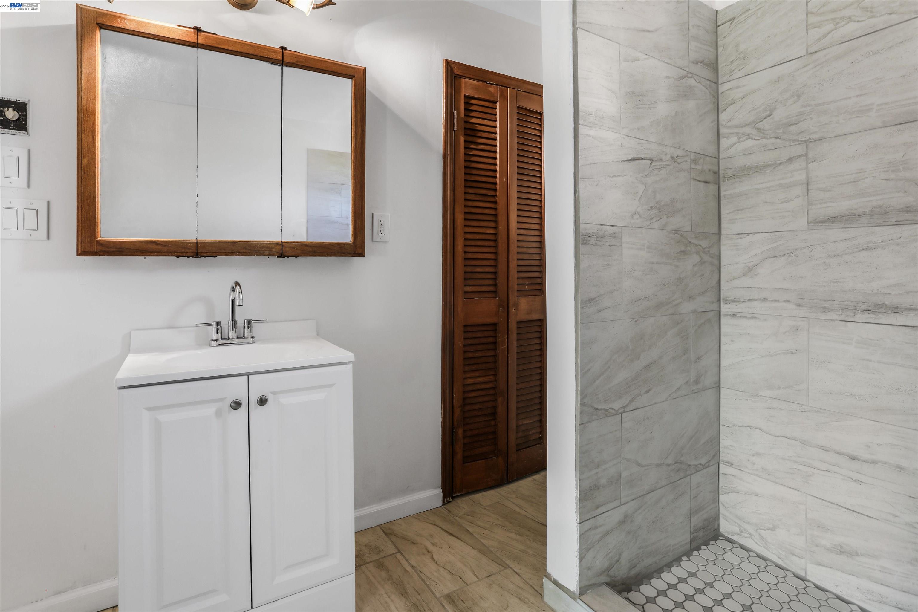 1925 Alpha Way Antioch, CA 94509 - Photo 11 of 26 a bathroom with a sink and a mirror