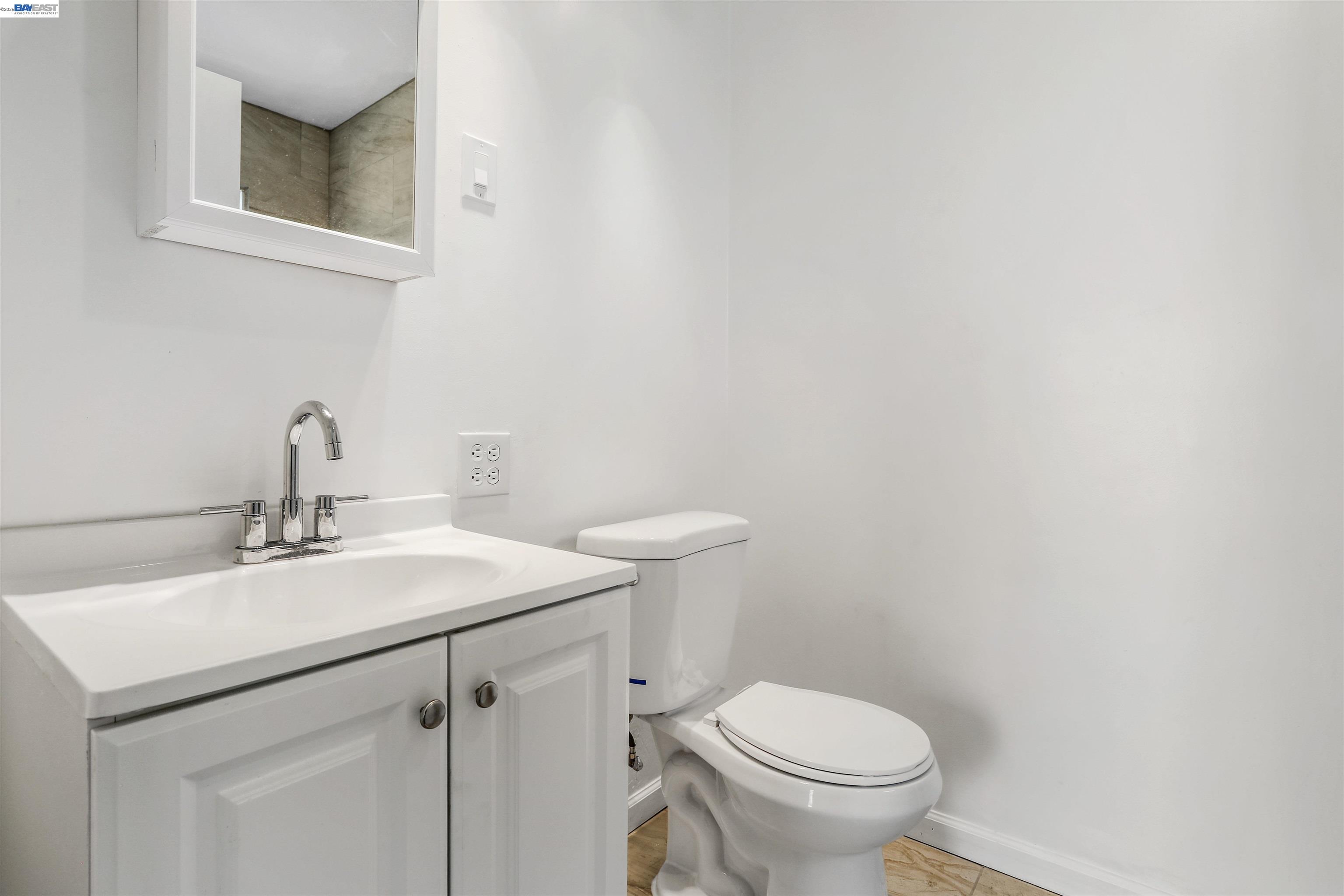 1925 Alpha Way Antioch, CA 94509 - Photo 20 of 26 a bathroom with a sink mirror and toilet