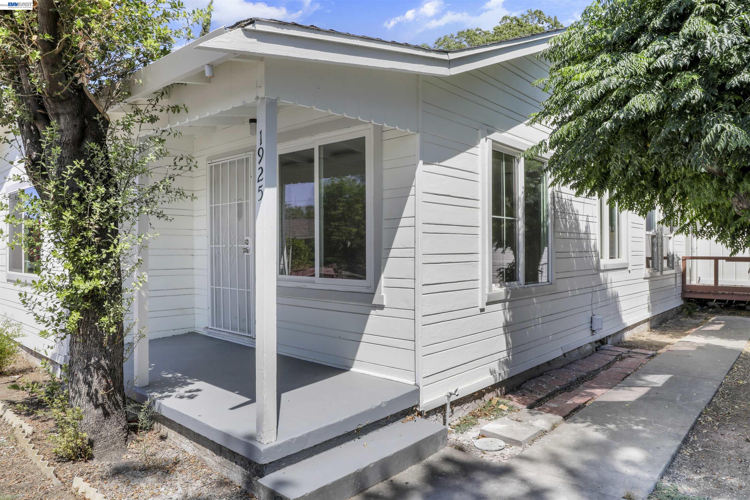 1925 Alpha Way Antioch, CA 94509 - Photo 3 of 26 a view of small white building with large tree