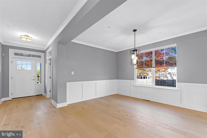 890 Alameda Drive Huntingtown, MD 20639 - Photo 23 of 51 an empty room with windows and entrance