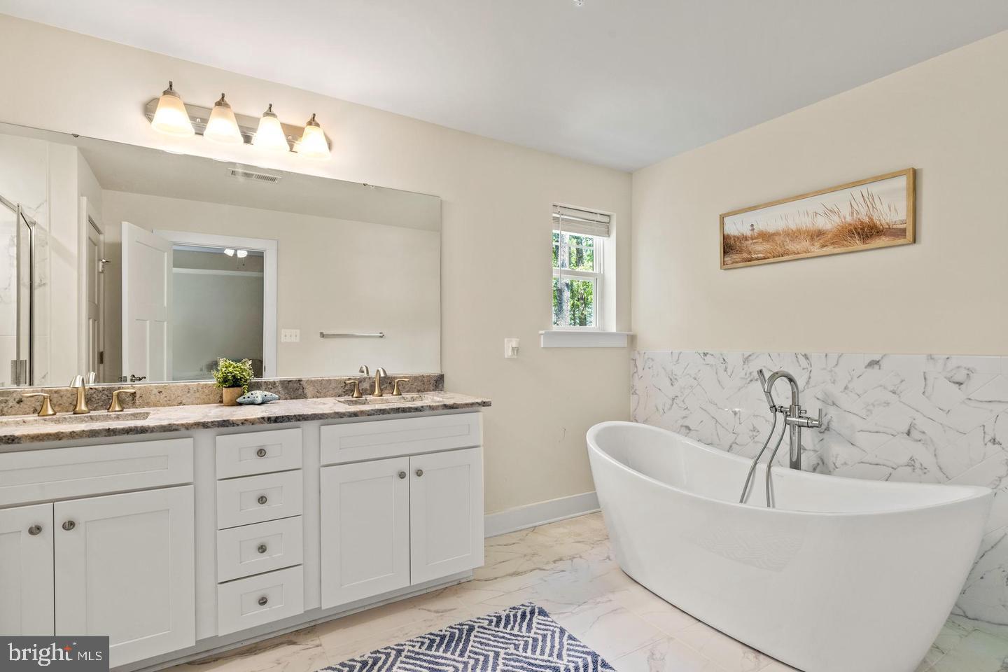 890 Alameda Drive Huntingtown, MD 20639 - Photo 32 of 51 a bath room with a sink and a mirror