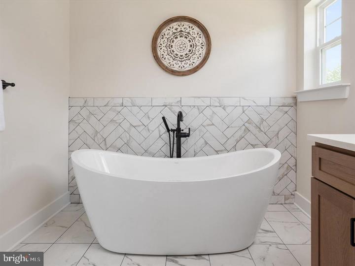 890 Alameda Drive Huntingtown, MD 20639 - Photo 34 of 51 a white bath tub sitting in a bathroom