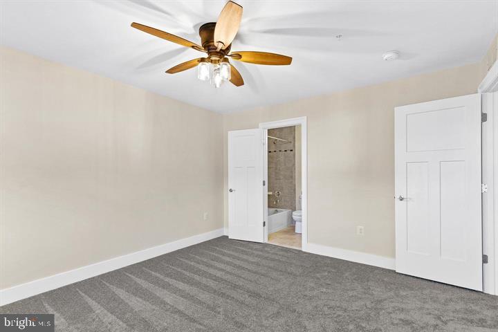 890 Alameda Drive Huntingtown, MD 20639 - Photo 38 of 51 a view of a room with a ceiling fan