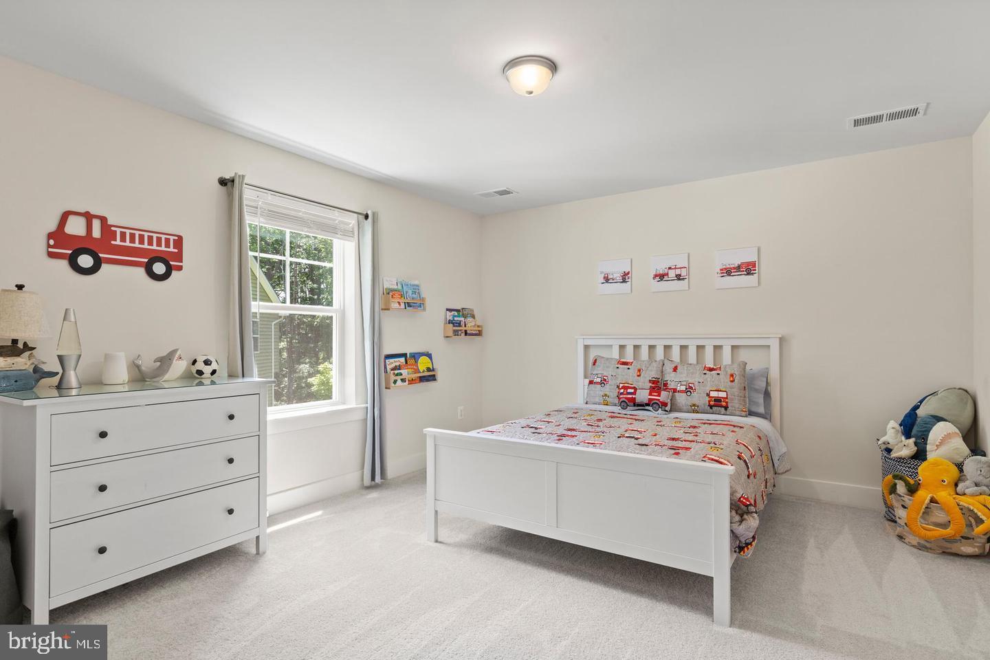 890 Alameda Drive Huntingtown, MD 20639 - Photo 39 of 51 a bedroom with a bed and a dresser