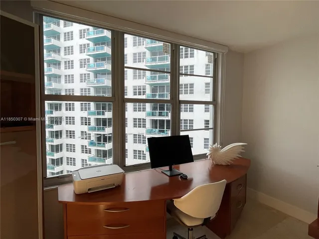 a work room with furniture and a window
