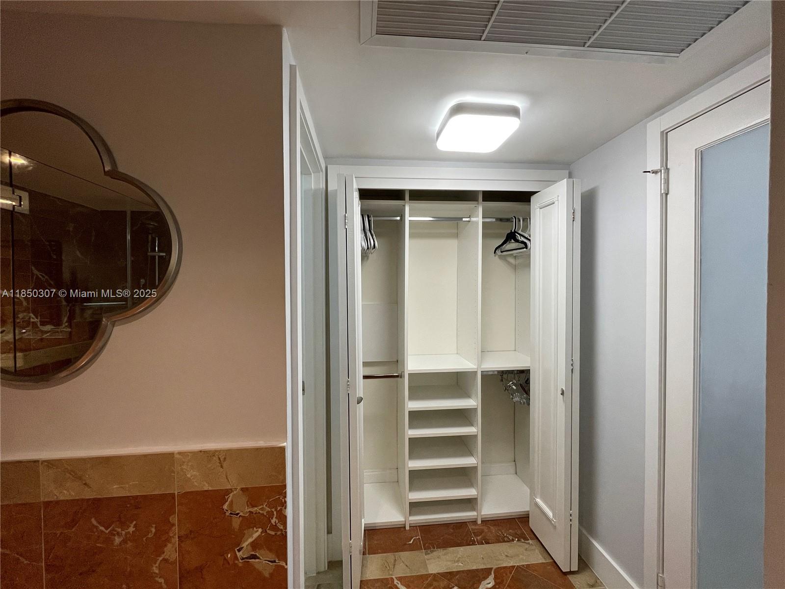 5151 Collins Avenue, Unit 825 Miami Beach, FL 33140 - Photo 28 of 28 a view of a livingroom with storage and utility