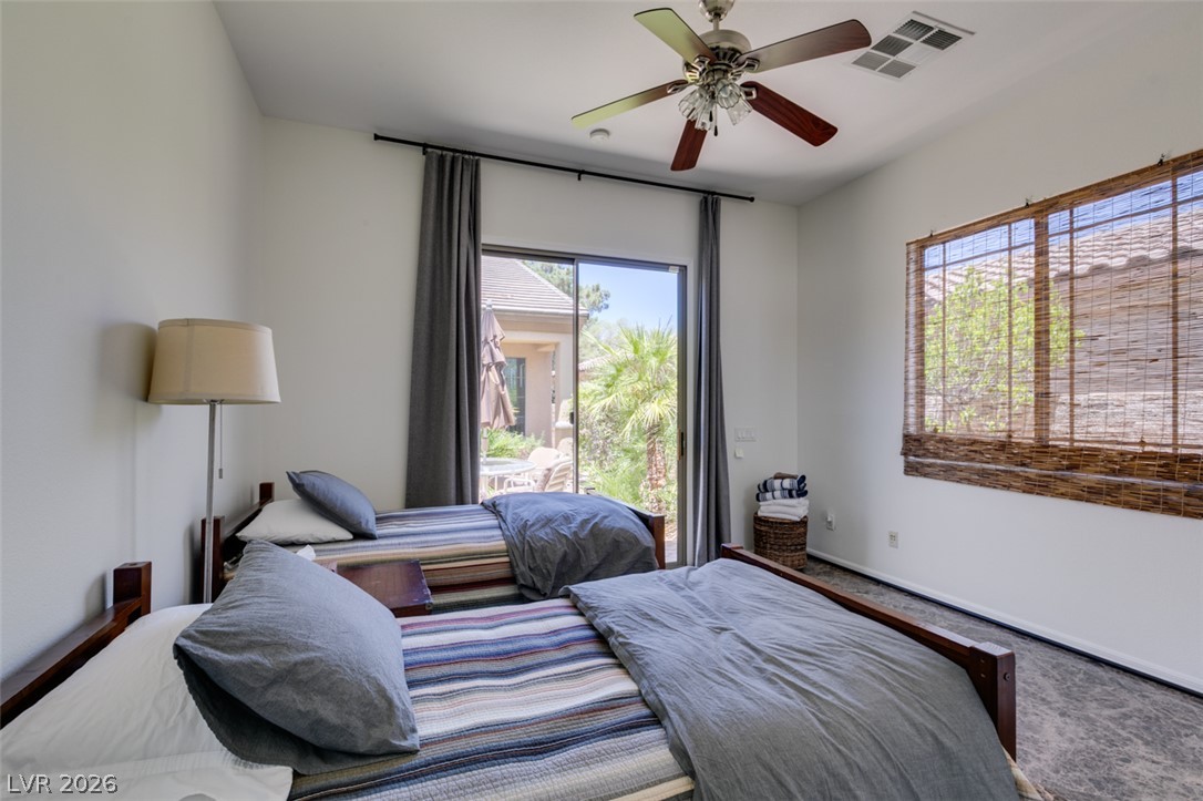 8 Kennesaw Road Henderson, NV 89052 - Photo 37 of 44 Sliding glass doors offer direct outdoor access from this comfortable bedroom.