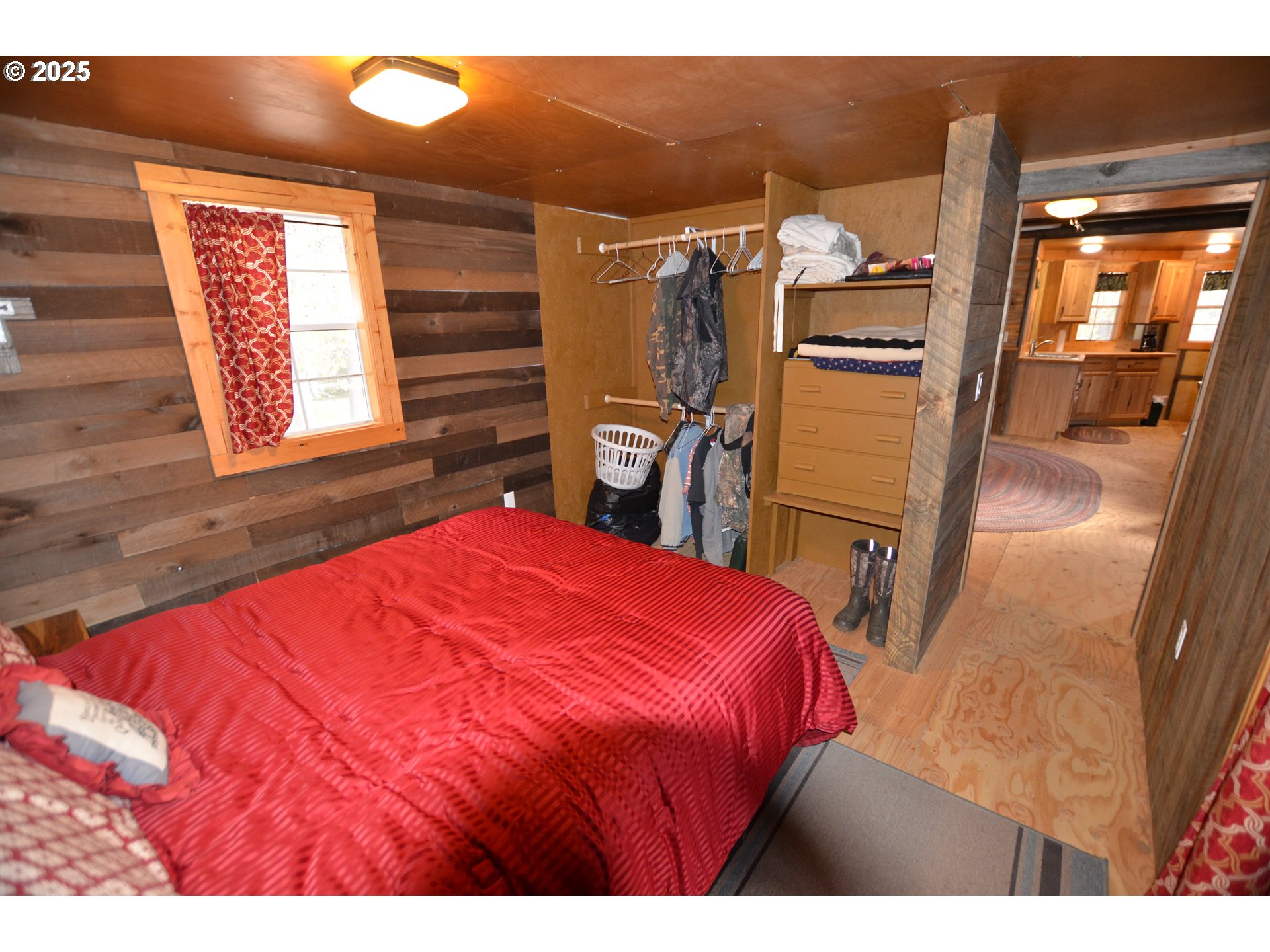 64955 Old Oregon Trail Meacham, OR 97859 - Photo 11 of 47 a bedroom with a bed and a flat screen tv