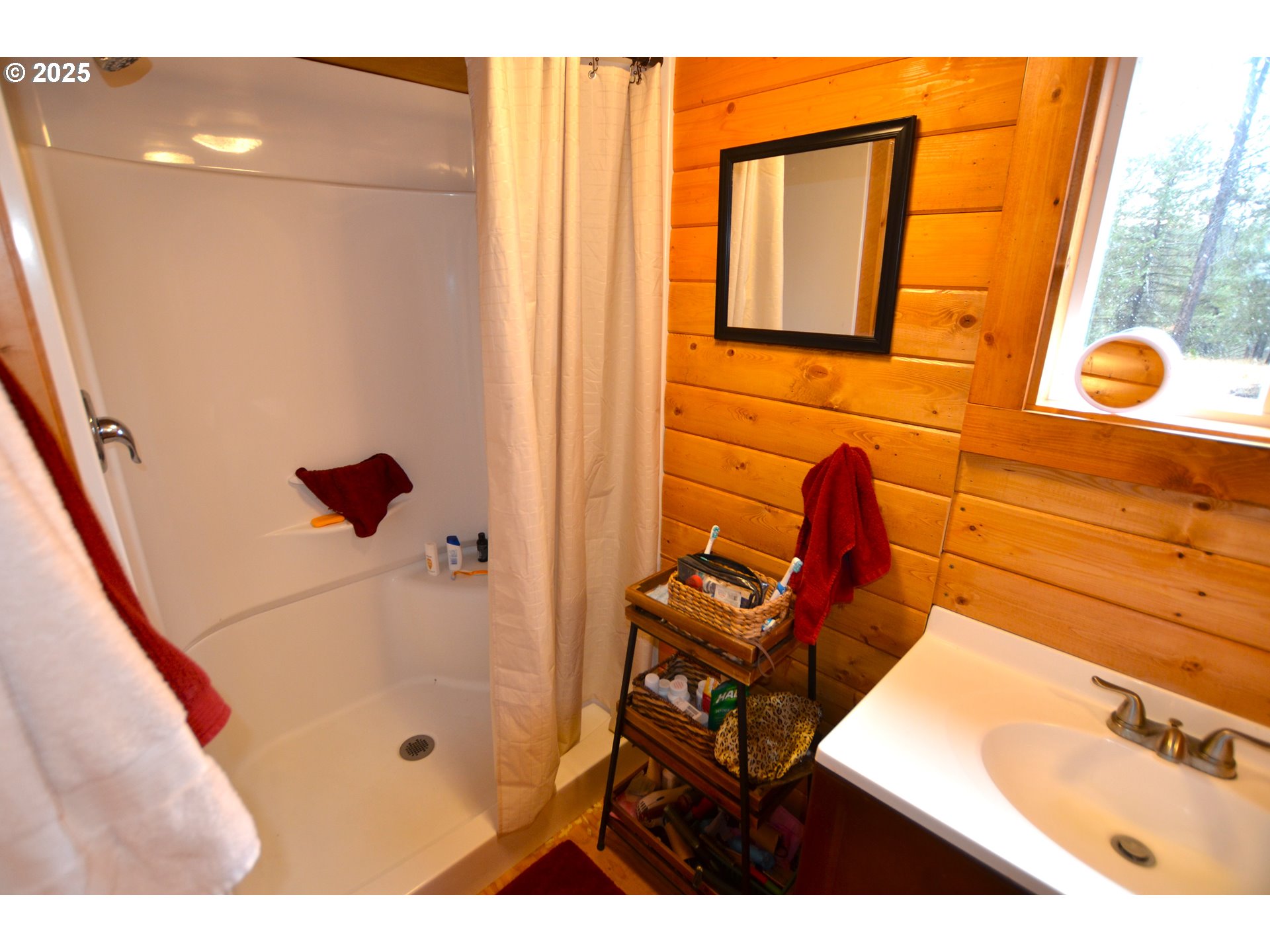 64955 Old Oregon Trail Meacham, OR 97859 - Photo 12 of 47 a bathroom with a tub sink and mirror