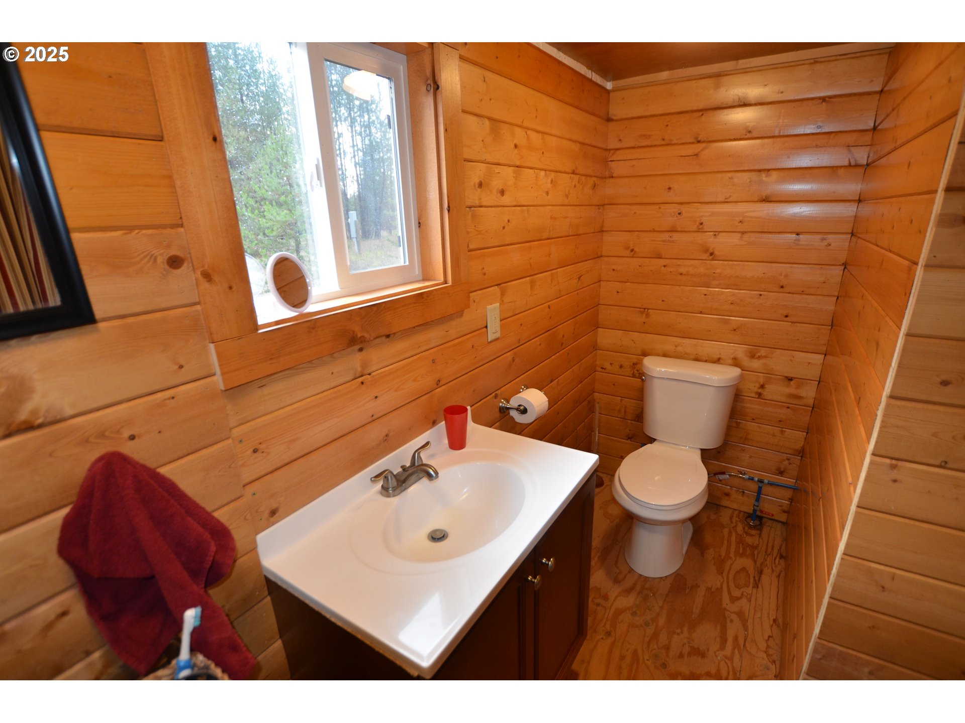 64955 Old Oregon Trail Meacham, OR 97859 - Photo 13 of 47 a bathroom with a toilet a sink and mirror