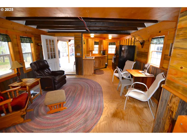 a room with furniture and wooden floor