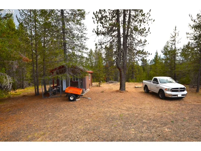 a view of a street with cars parked