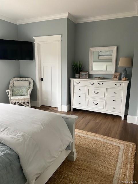 224 Wilmot Road Ocean Beach, NY 11770 - Photo 11 of 17 a bedroom with a bed and a potted plant