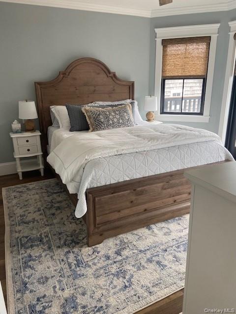 224 Wilmot Road Ocean Beach, NY 11770 - Photo 12 of 17 a bedroom with a bed and window