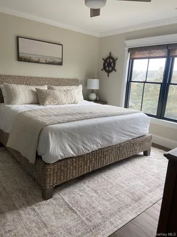 a bedroom with a bed and window