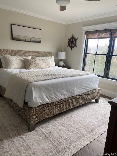 224 Wilmot Road Ocean Beach, NY 11770 - Photo 13 of 17 a bedroom with a bed and window