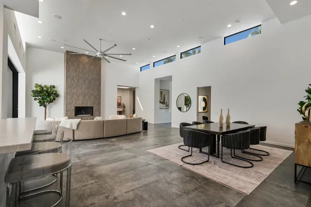 a large kitchen with a counter space a sink appliances and cabinets