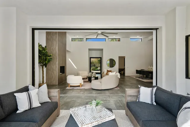 a large kitchen with kitchen island a sink a counter and stainless steel appliances