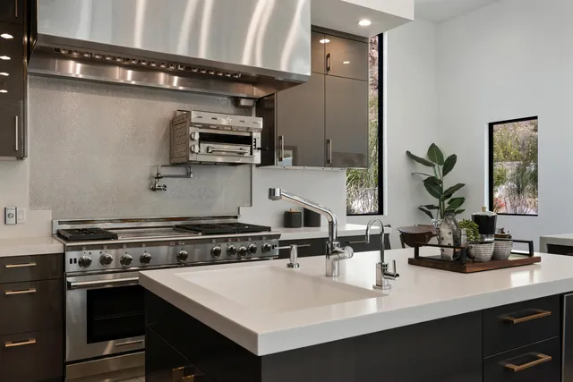 a bed room with a bed mirror and a table