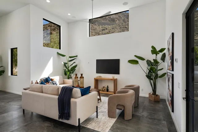 a balcony with furniture and a potted plant