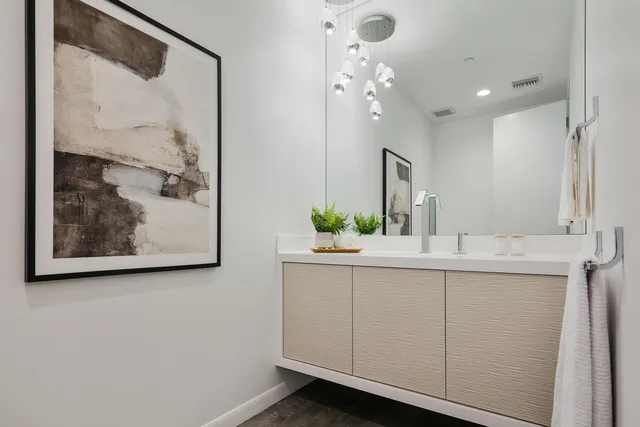 a bathroom with a bathtub and next to a window