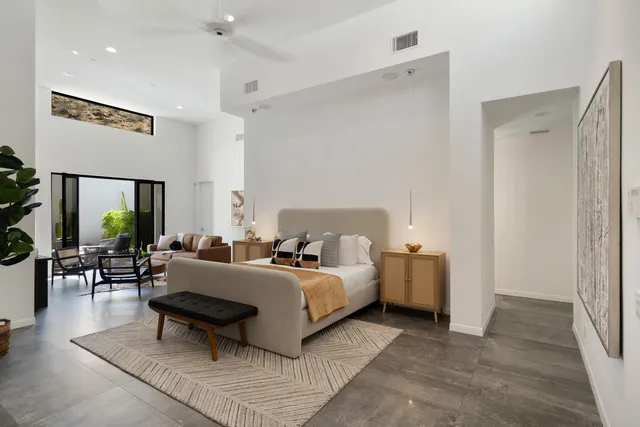 a large bathroom with a double vanity sink a large mirror and a shower