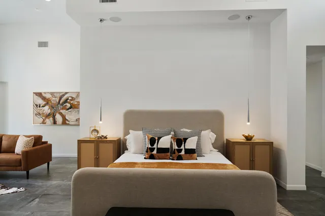 a bedroom with a bed and glass window