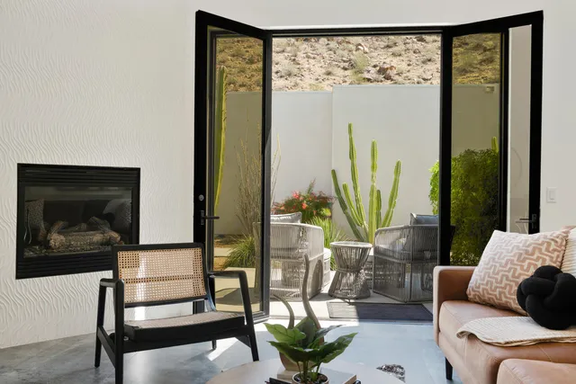 a bedroom with a bed and a couch