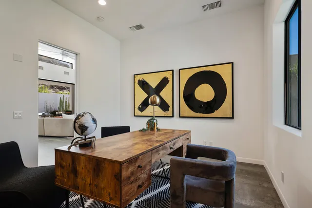 a bathroom with a double vanity sink toilet and a mirror