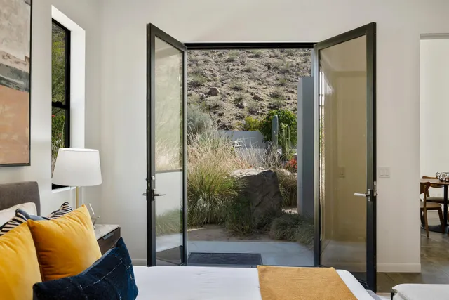 a view of a house with swimming pool and sitting area
