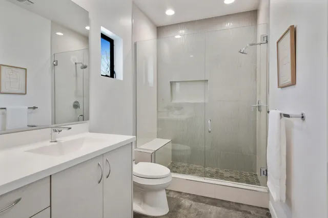 a view of a house with backyard sitting area and swimming pool