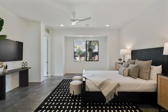 a view of a house with a flower garden