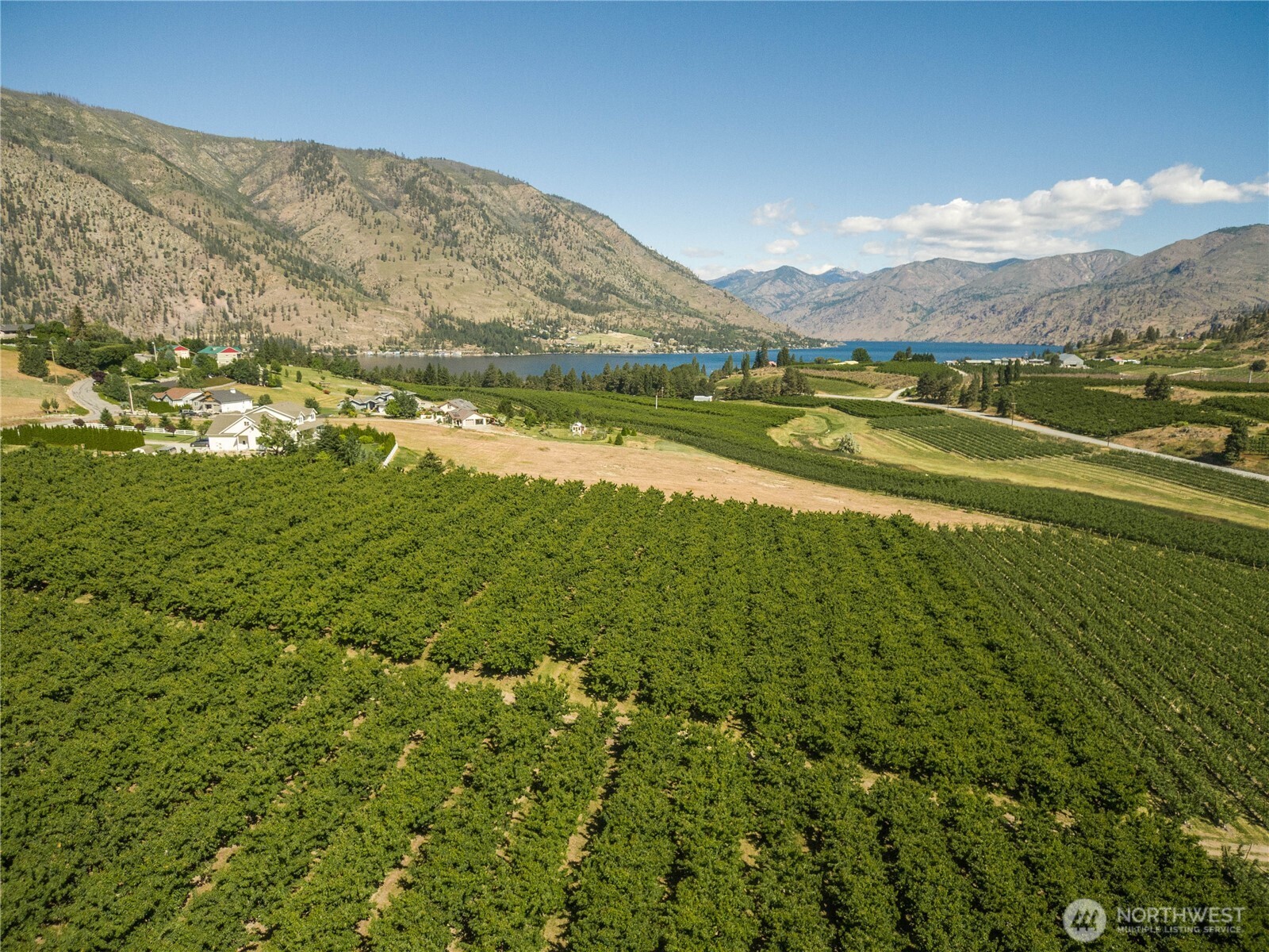 984 Loop Avenue Manson, WA 98831 - Photo 2 of 14 a view of lake with mountain