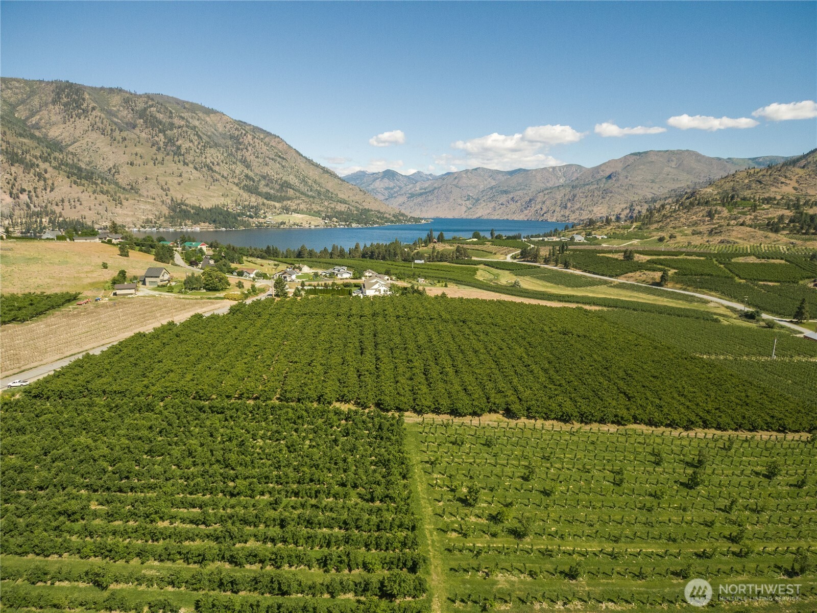 984 Loop Avenue Manson, WA 98831 - Photo 6 of 14 a view of an ocean and a mountain