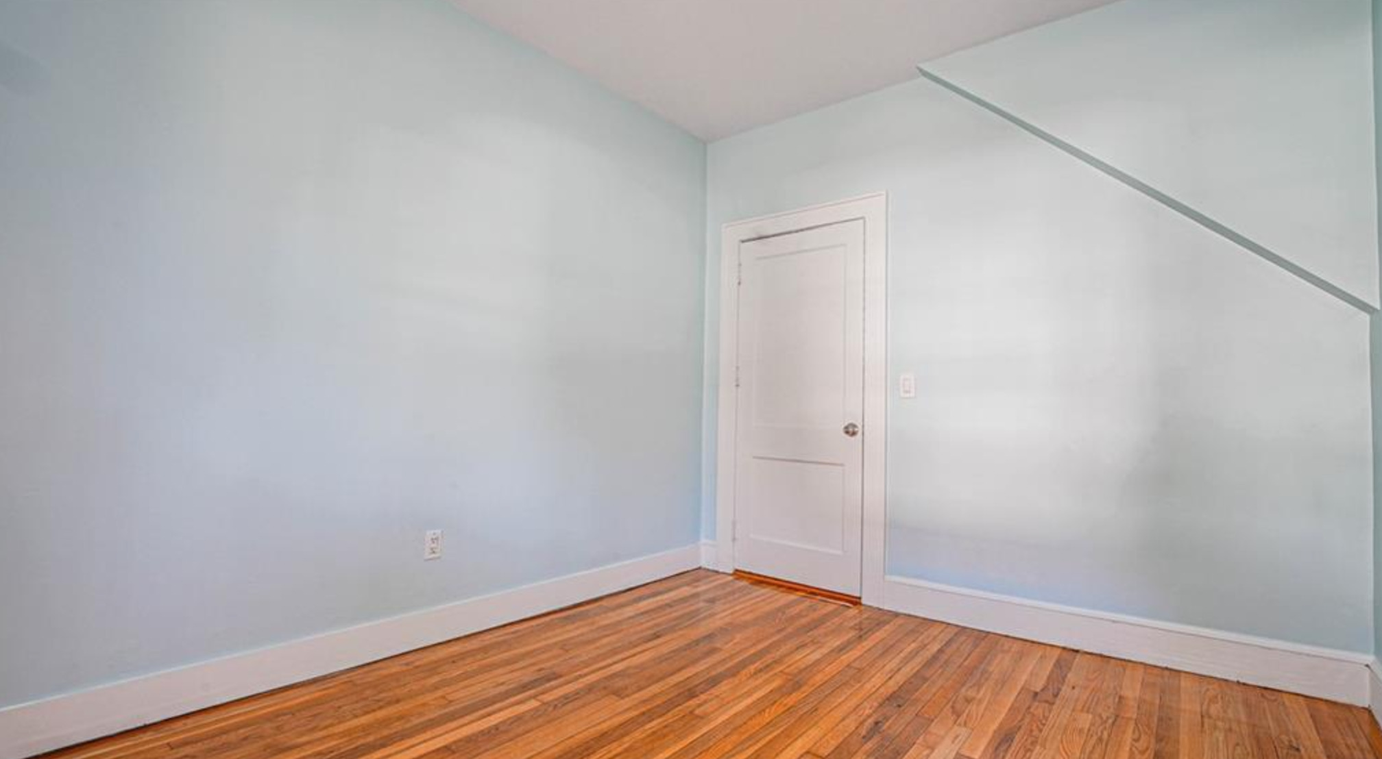 240 Flax Hill Road Norwalk, CT 06854 - Photo 14 of 15 a view of an empty room with wooden floor