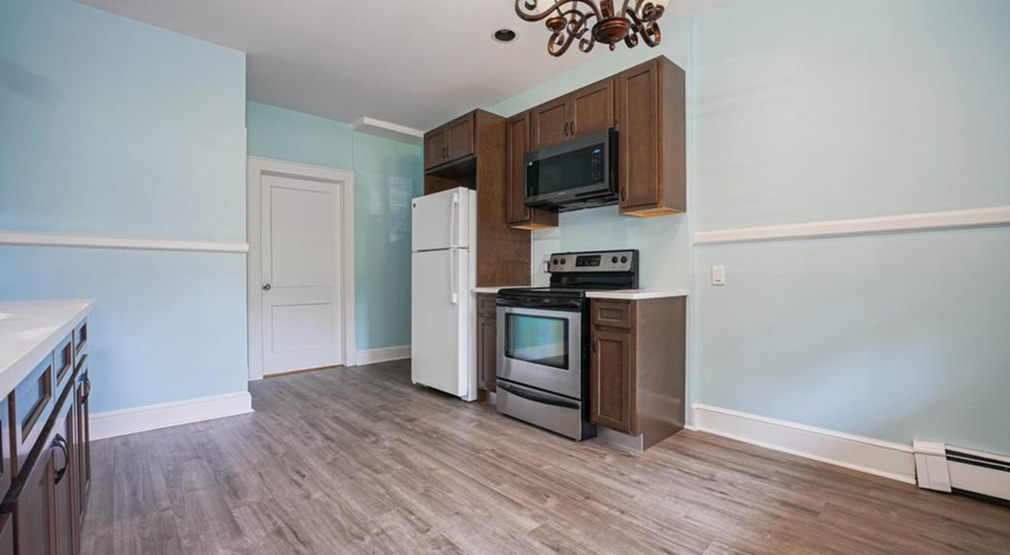 240 Flax Hill Road Norwalk, CT 06854 - Photo 4 of 15 a kitchen with stainless steel appliances a refrigerator microwave and sink
