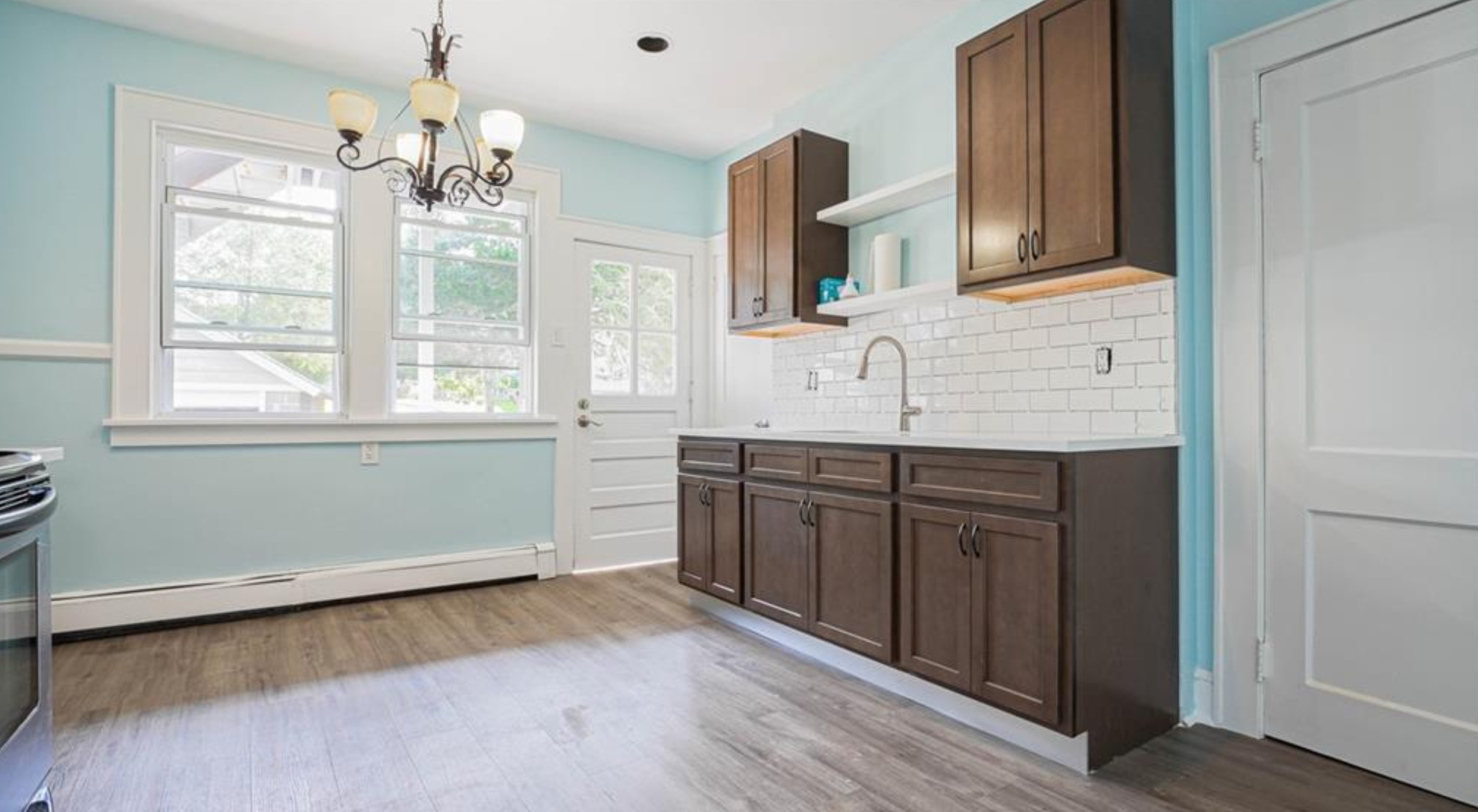 240 Flax Hill Road Norwalk, CT 06854 - Photo 6 of 15 a kitchen with granite countertop a stove a sink and a window