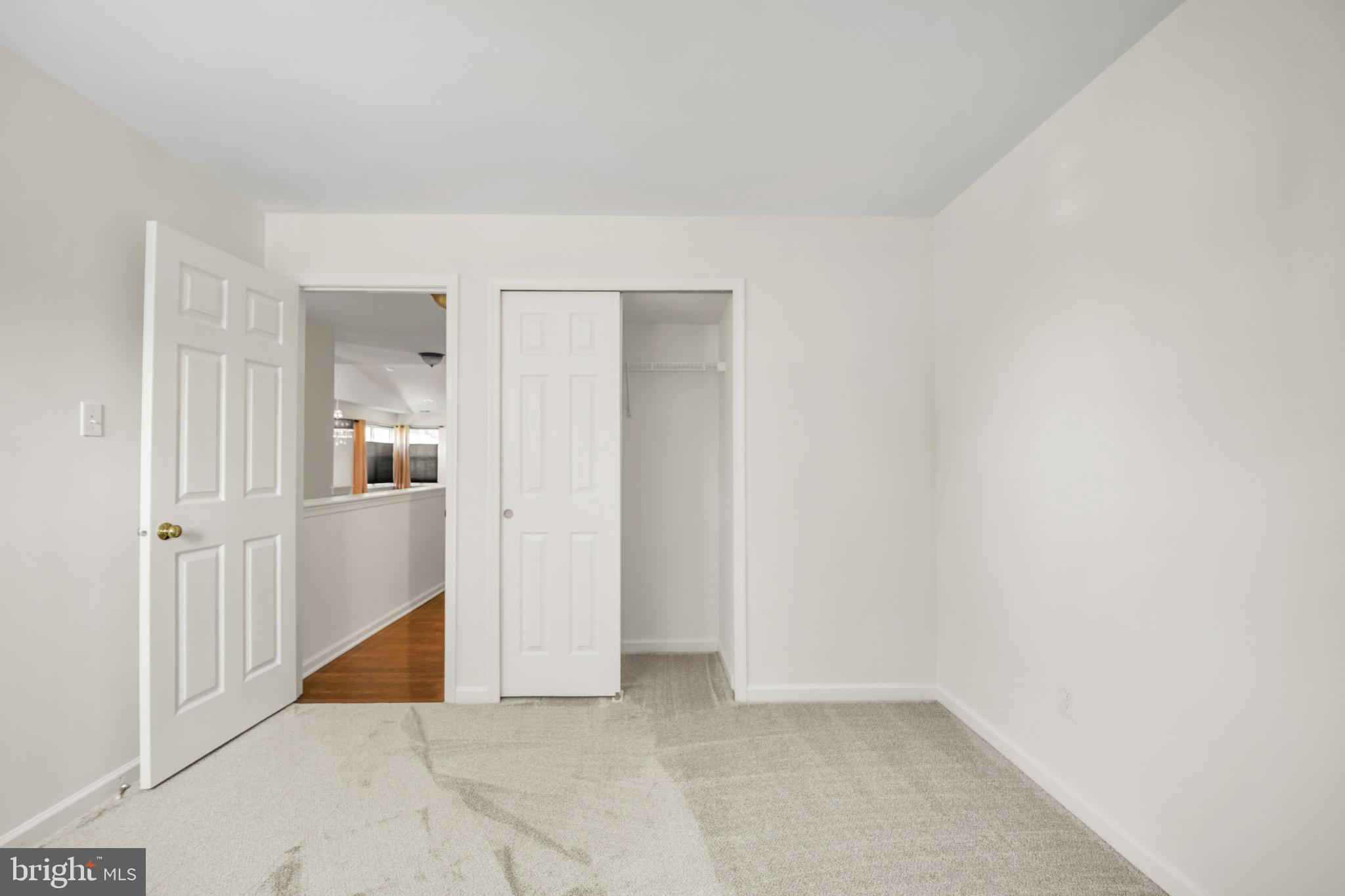 2402 Waterford Road, Unit 94 Yardley, PA 19067 - Photo 21 of 28 an empty room with wooden floor