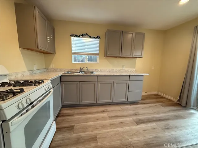a kitchen with a stove and a sink