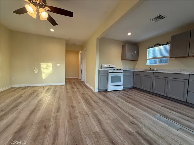 a view of a kitchen with microwave and stove