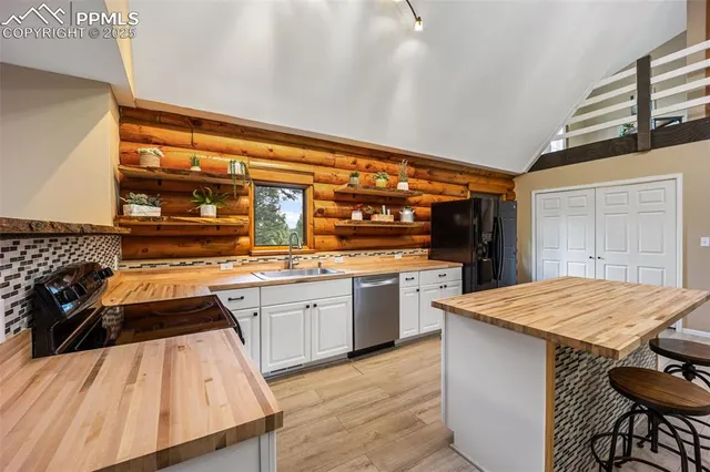 a kitchen with a sink and wooden cabinets