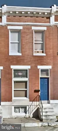 a view of a house with a door and a window